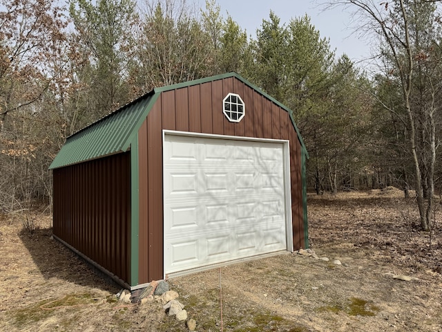 detached garage with dirt driveway