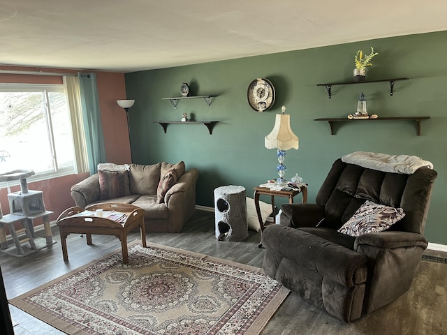 living room with wood finished floors and baseboards