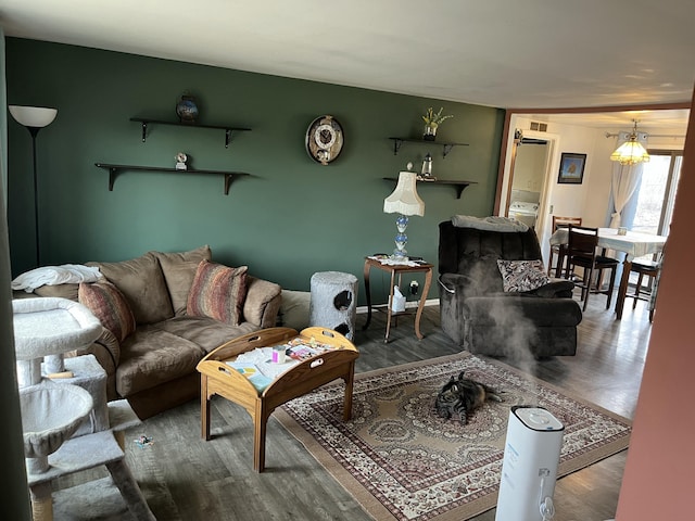 living area with wood finished floors and baseboards