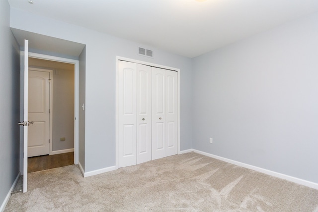 4355 S Lapeer Rd, Metamora, MI 48455 - unfurnished bedroom featuring a closet, baseboards, visible vents, and carpet floors