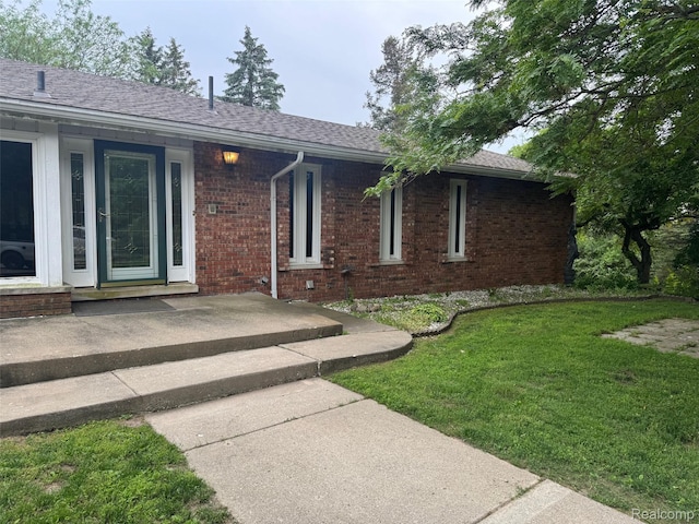 4355 S Lapeer Rd, Metamora, MI 48455 - property entrance with a lawn and brick siding