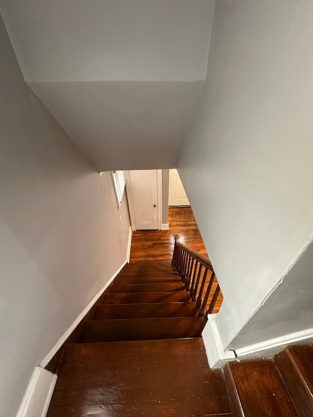 staircase featuring hardwood / wood-style floors