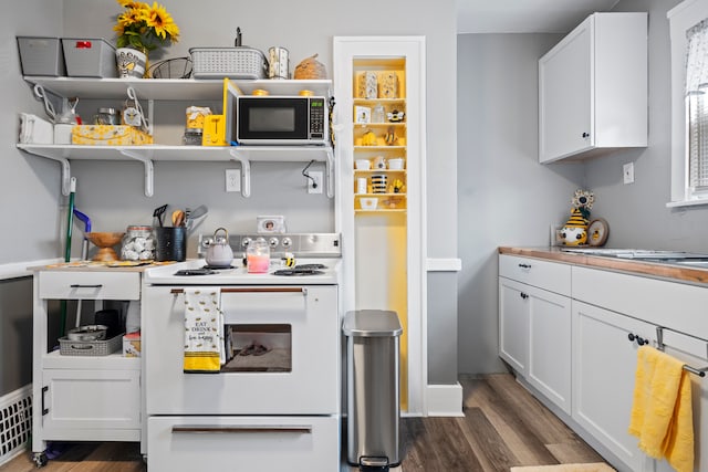 kitchen with dark wood finished floors, white cabinets, light countertops, and white electric range oven