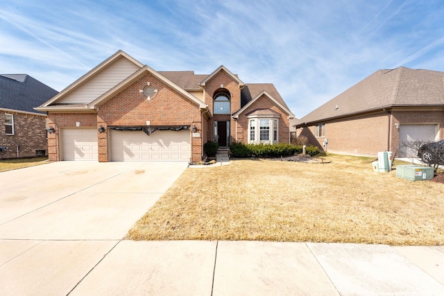 traditional-style home featuring brick siding, concrete driveway, and a garage