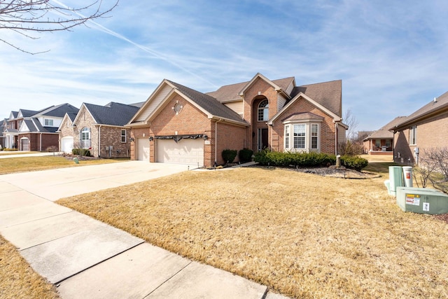 view of front of home featuring a residential view, concrete driveway, a front lawn, a garage, and brick siding