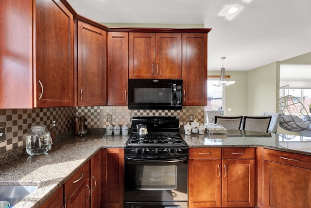 kitchen with black appliances, light stone counters, a peninsula, and backsplash