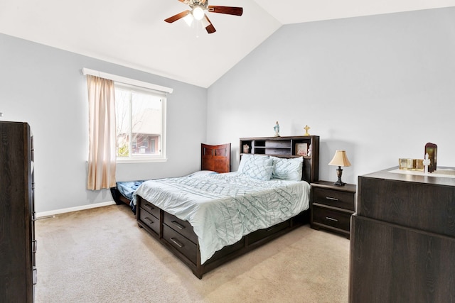 bedroom featuring baseboards, light colored carpet, a ceiling fan, and vaulted ceiling