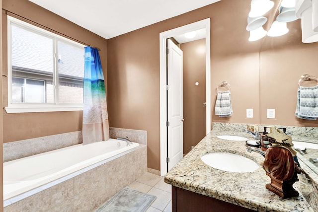 bathroom with tile patterned flooring, double vanity, a bath, and a sink