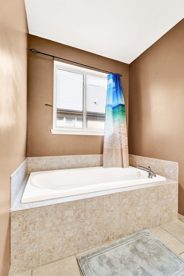 full bathroom featuring tile patterned floors and a garden tub