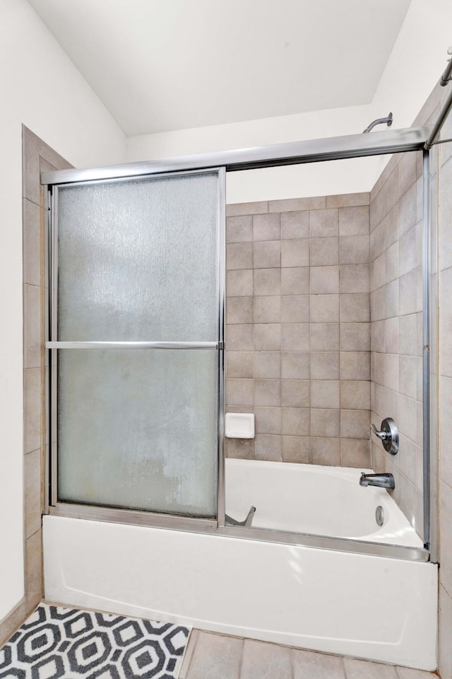 full bathroom featuring bath / shower combo with glass door