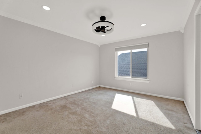 carpeted empty room featuring recessed lighting, ceiling fan, baseboards, and ornamental molding