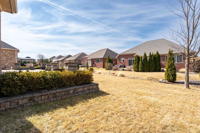 view of yard featuring a residential view