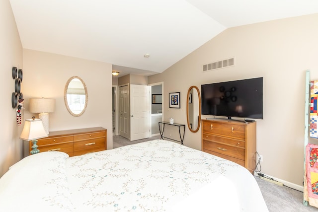 bedroom with visible vents, light carpet, a closet, and vaulted ceiling