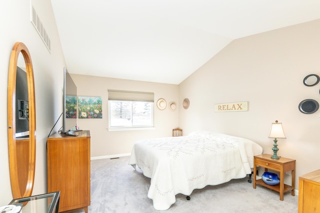 carpeted bedroom featuring visible vents, lofted ceiling, and baseboards