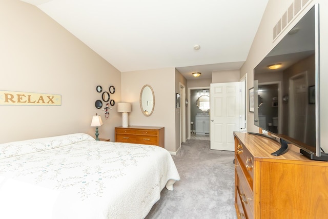 bedroom with visible vents, lofted ceiling, light colored carpet, and baseboards