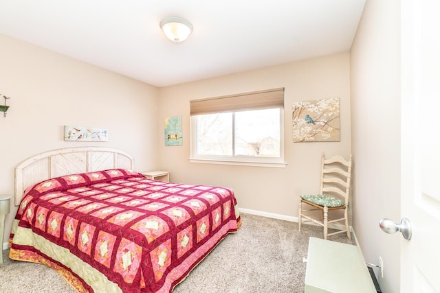 bedroom with carpet and baseboards