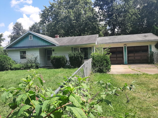 single story home featuring fence, a chimney, concrete driveway, a front lawn, and a garage