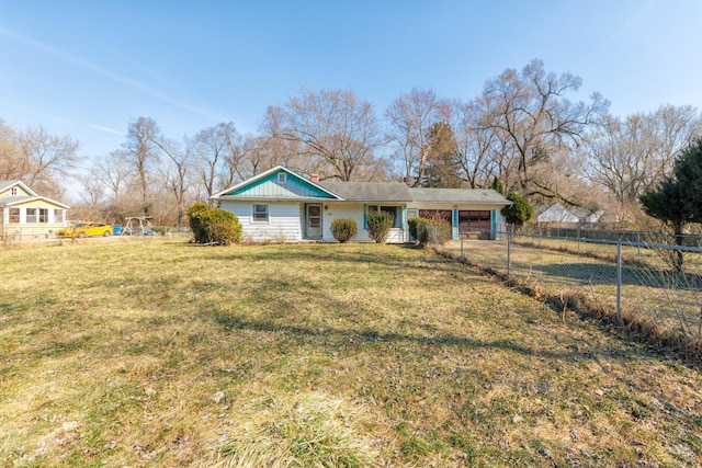 view of front of home featuring an attached carport, a front yard, and fence