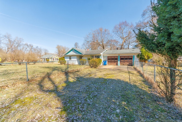 view of front facade with a garage, a chimney, driveway, and fence