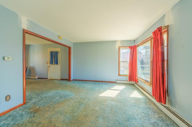 empty room with baseboards, a baseboard heating unit, carpet, and a baseboard radiator