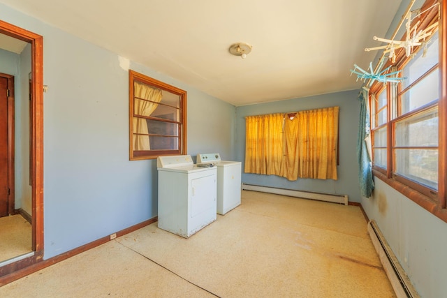 laundry area featuring baseboards, washer and clothes dryer, baseboard heating, laundry area, and a baseboard radiator