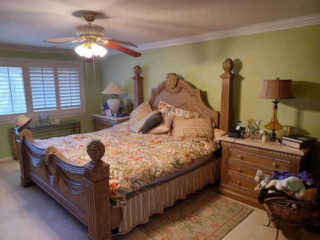 bedroom featuring carpet floors, ceiling fan, and ornamental molding