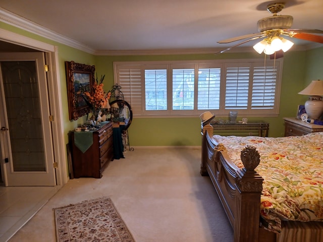 bedroom featuring carpet, ceiling fan, and crown molding