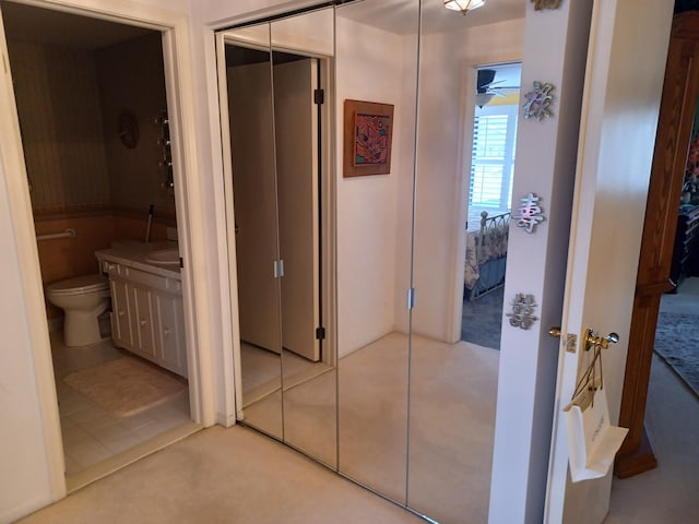 hallway with tile patterned flooring