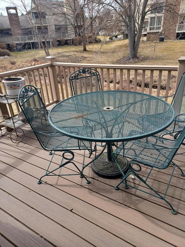 wooden deck featuring outdoor dining area