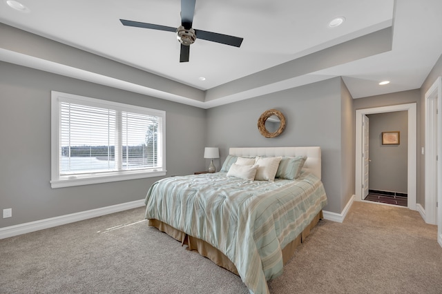 carpeted bedroom featuring recessed lighting, baseboards, and a ceiling fan