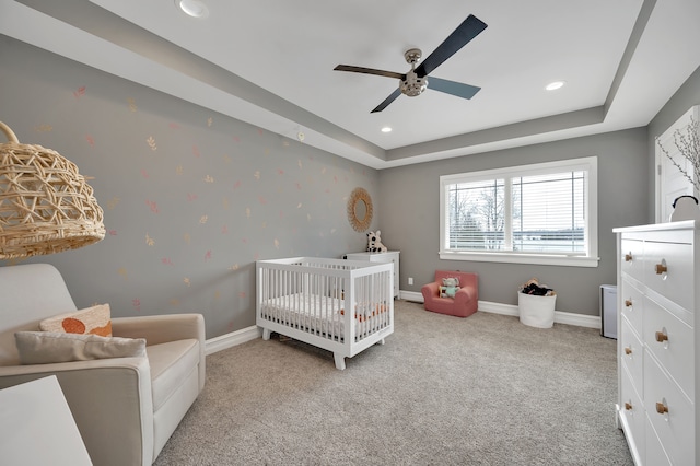 bedroom featuring baseboards, carpet flooring, a crib, and recessed lighting