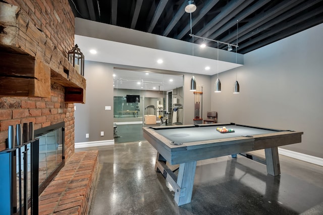 playroom featuring baseboards, concrete flooring, billiards, and a towering ceiling