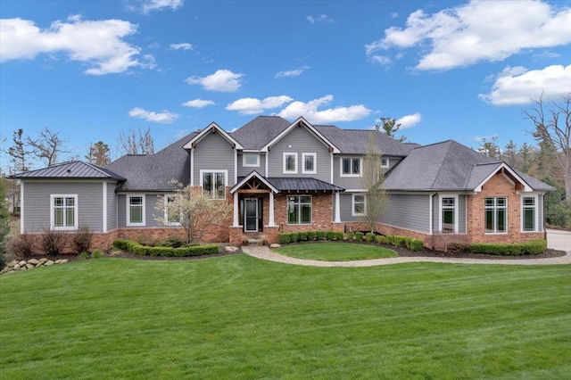 craftsman-style house featuring a front lawn and brick siding