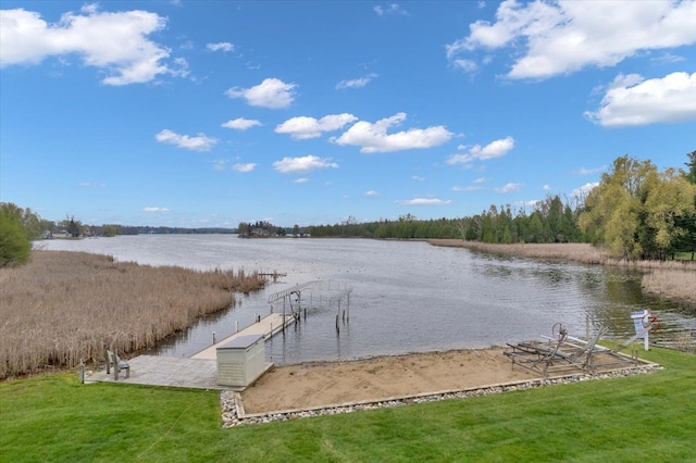 exterior space with a water view and a yard