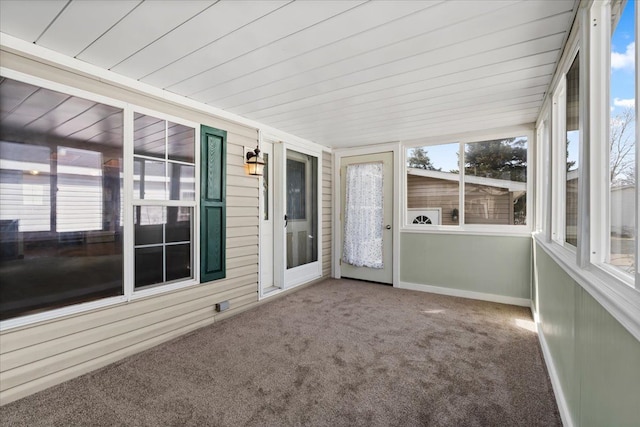 unfurnished sunroom featuring wooden ceiling