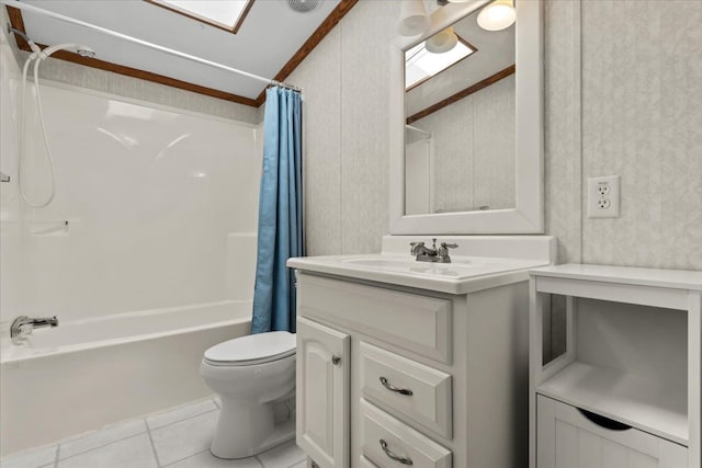 full bathroom with tile patterned flooring, toilet, a skylight, shower / bath combination with curtain, and vanity