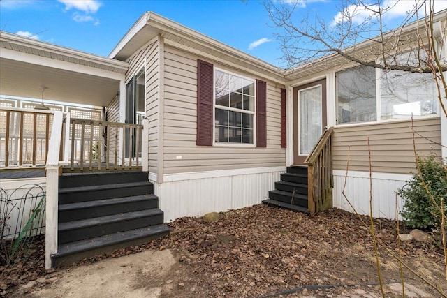 view of home's exterior with entry steps