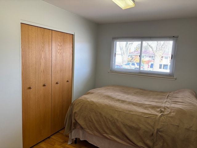 bedroom with a closet and wood finished floors