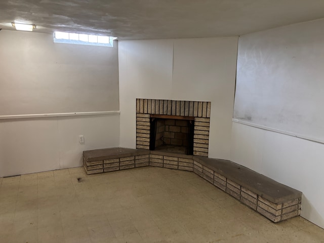 unfurnished living room with tile patterned floors and a fireplace