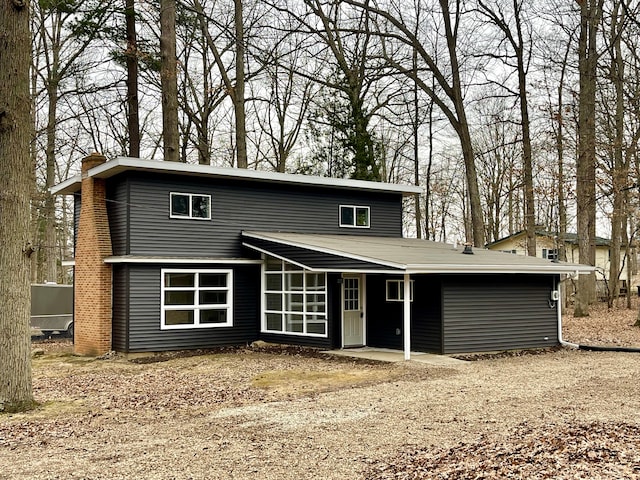 view of front of property featuring a chimney