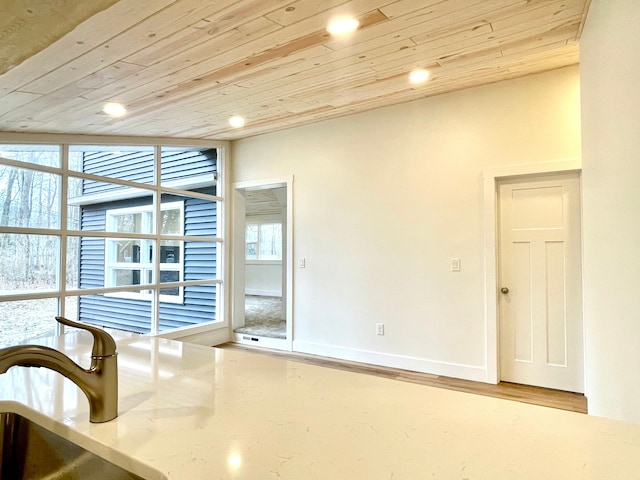 interior space featuring wood finished floors, recessed lighting, wood ceiling, and baseboards