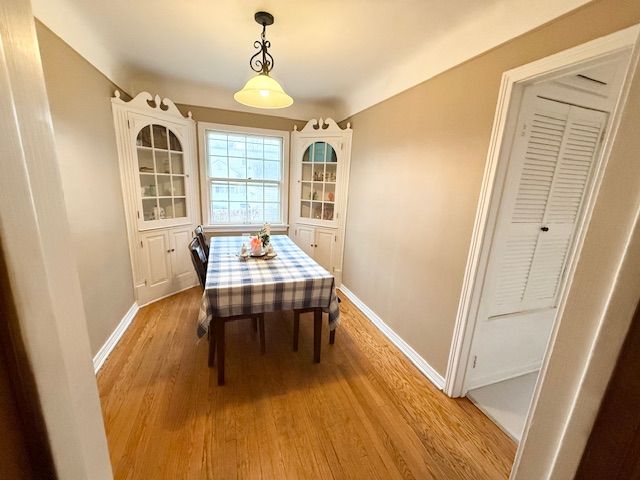 2126 Pierce St, Flint, MI 48503 - dining area featuring baseboards and light wood-type flooring
