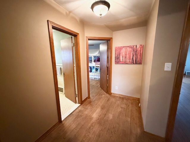 2126 Pierce St, Flint, MI 48503 - hallway featuring baseboards and wood finished floors