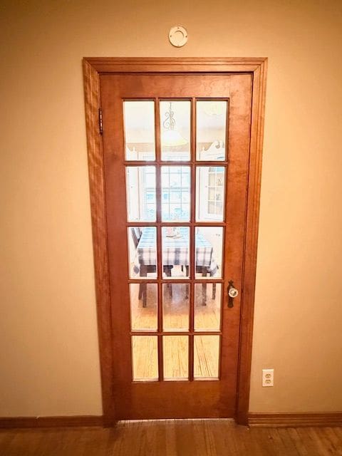 2126 Pierce St, Flint, MI 48503 - entryway with baseboards and wood finished floors
