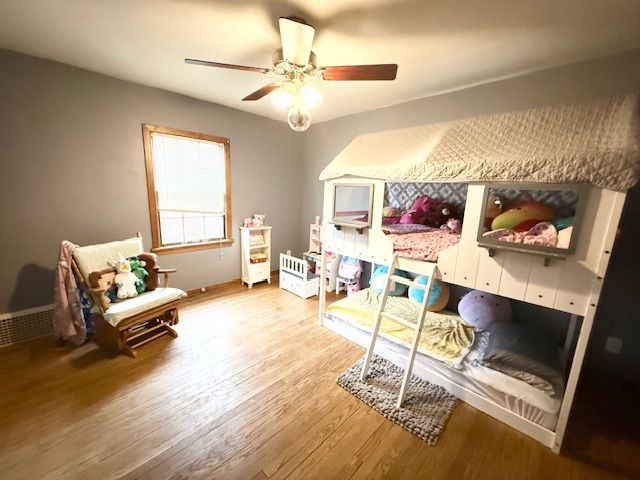 2126 Pierce St, Flint, MI 48503 - bedroom with ceiling fan, baseboards, and light wood finished floors