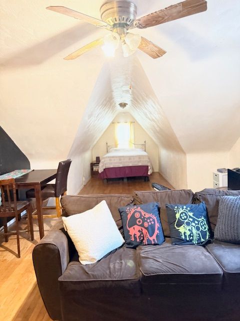 2126 Pierce St, Flint, MI 48503 - bedroom featuring a ceiling fan, wood finished floors, and lofted ceiling