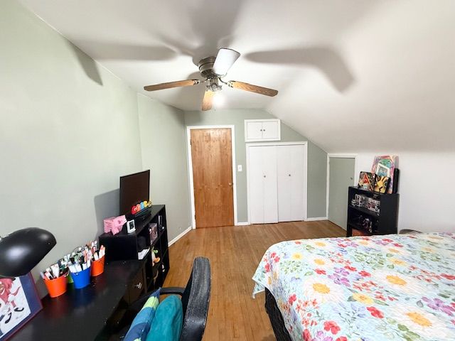 2126 Pierce St, Flint, MI 48503 - bedroom featuring ceiling fan, vaulted ceiling, and wood finished floors