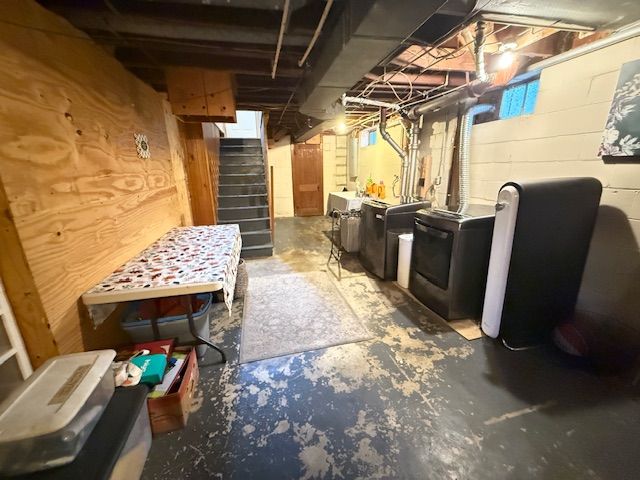 2126 Pierce St, Flint, MI 48503 - below grade area featuring stairway and washer / dryer