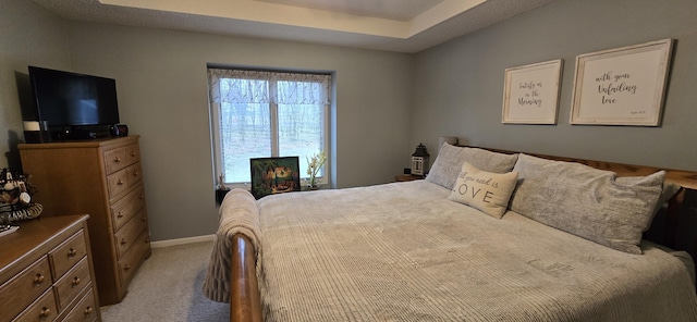 carpeted bedroom with baseboards