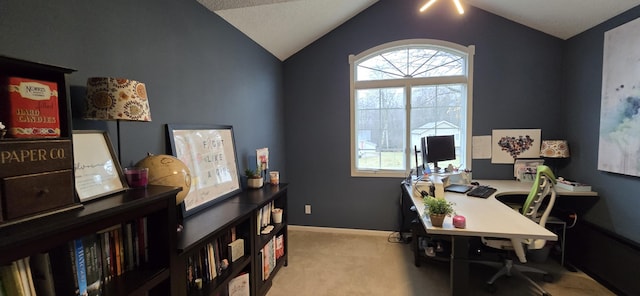 home office with baseboards, carpet, a healthy amount of sunlight, and vaulted ceiling